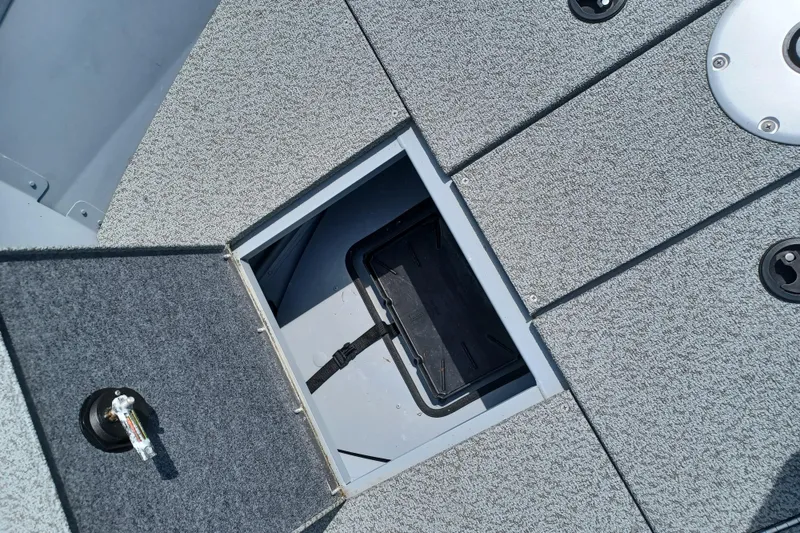 Slide: The Image of Open storage compartment on 2021 G3 Guide V150 T boat deck. - 15