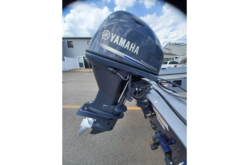 Slide: The Image of Yamaha outboard motor on G3 Guide V150 T boat, 2021 model, in a parking area. - 6