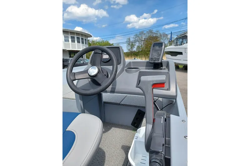 Slide: The Image of 2021 G3 Guide V150 T boat console with steering wheel and navigation equipment. - 8