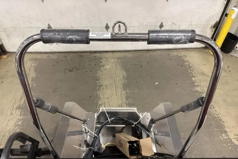 Slide: The Image of 2026 Bennington S 20 SSR boat frame with protective padding in a garage setting. - 16