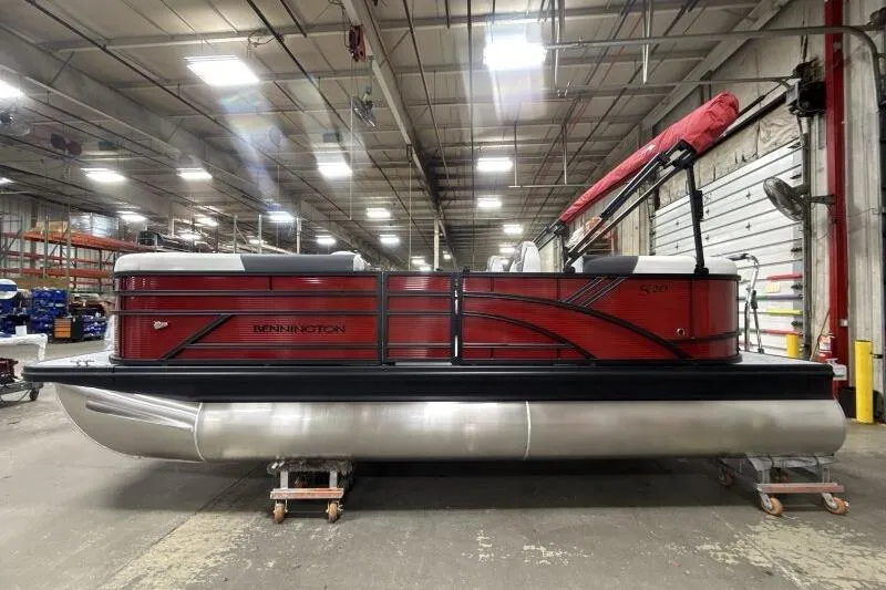 Slide: The Image of 2026 Bennington S 20 SSR pontoon boat in a warehouse setting. - 18