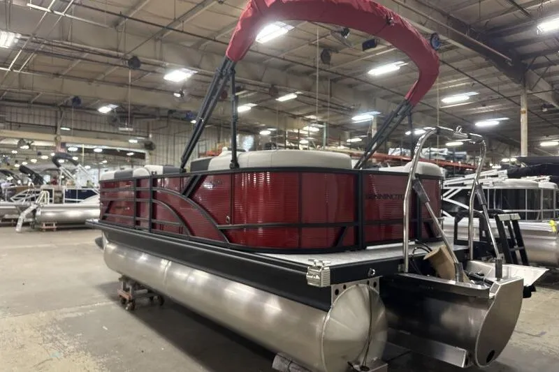 Slide: The Image of 2026 Bennington S 20 SSR pontoon boat in a warehouse setting. - 19