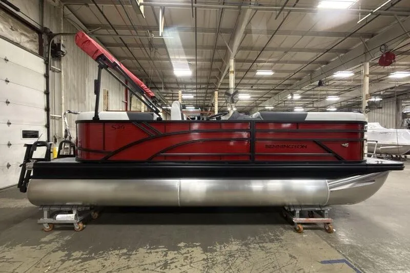 Slide: The Image of 2026 Bennington S 20 SSR pontoon boat in a warehouse setting. - 22