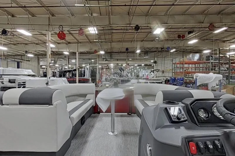 Slide: The Image of Interior view of 2026 Bennington S 20 SSR pontoon boat in a factory setting. - 23