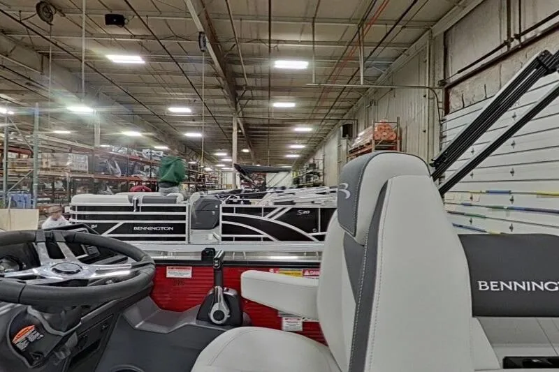 Slide: The Image of 2026 Bennington S 20 SSR pontoon boat interior in a factory setting. - 24