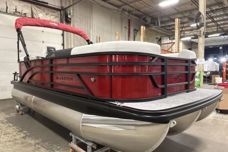 Slide: The Image of 2026 Bennington S 20 SSR pontoon boat in a warehouse setting. - 4