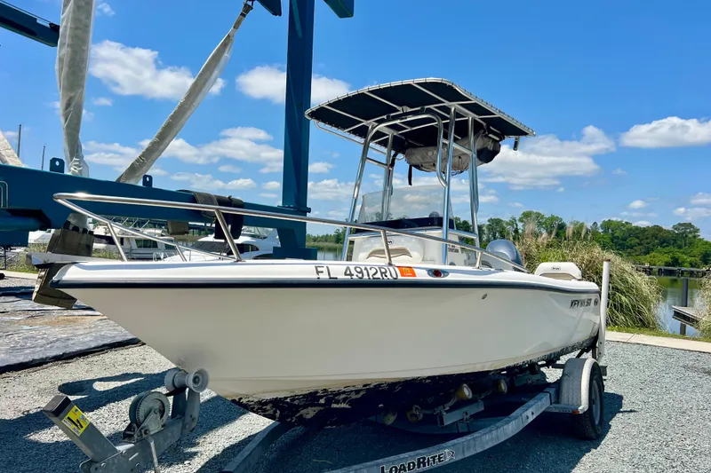 The Image of 2010 Key West 186 Sportsman boat on trailer under clear blue sky. - 1