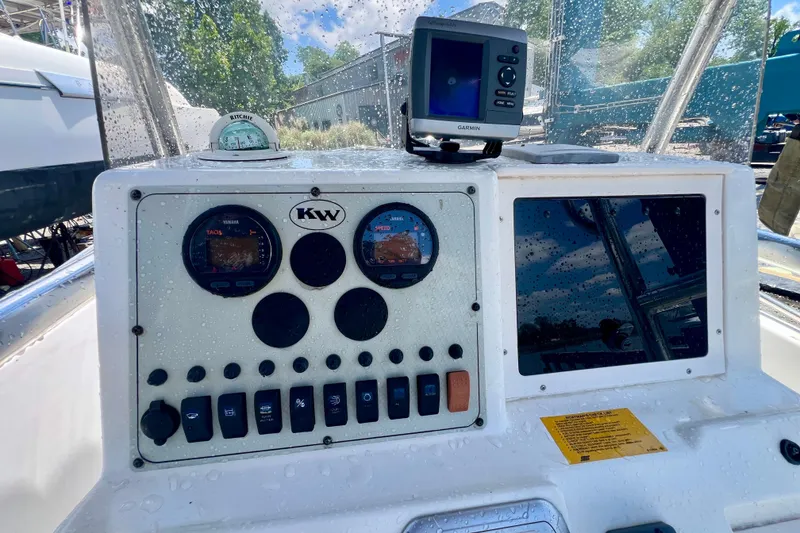 Slide: The Image of Dashboard of a 2010 Key West 186 Sportsman boat with gauges and Garmin GPS. - 12