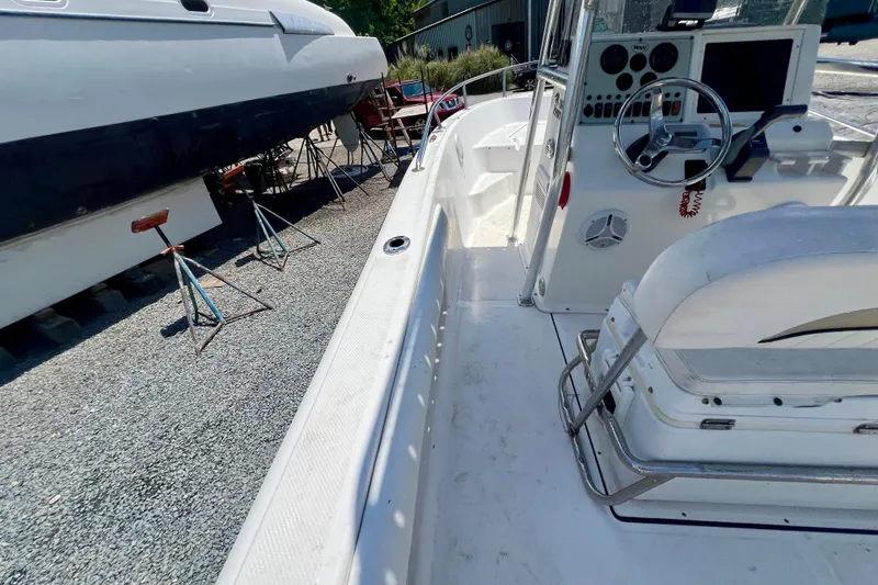 Slide: The Image of 2010 Key West 186 Sportsman boat interior with steering console and seating. - 14