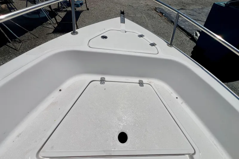 Slide: The Image of Bow area of a 2010 Key West 186 Sportsman boat, featuring storage compartments. - 17