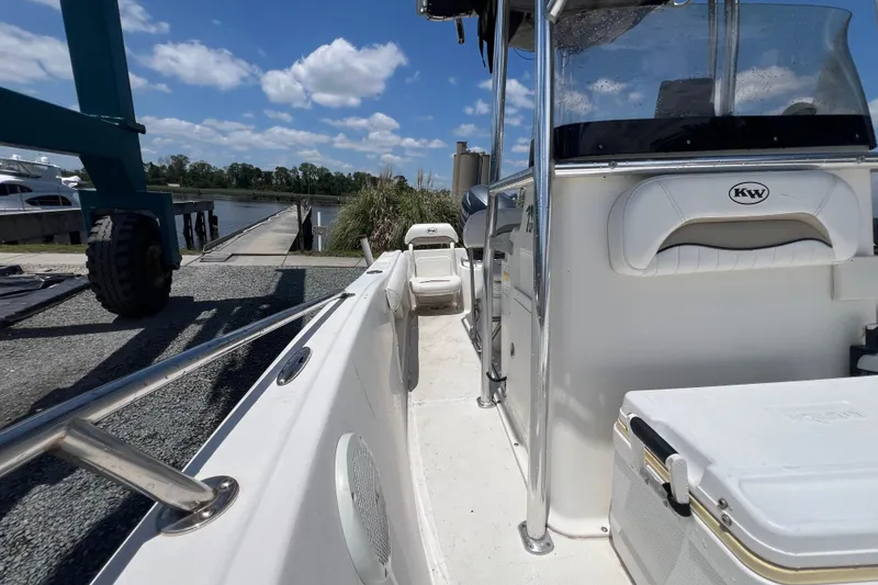 Slide: The Image of 2010 Key West 186 Sportsman boat docked, featuring sleek design and spacious deck. - 21