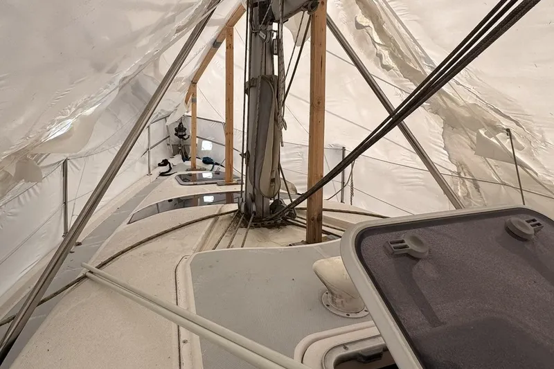 Slide: The Image of Interior view of a 1997 Hunter 340 sailboat under protective cover. - 10