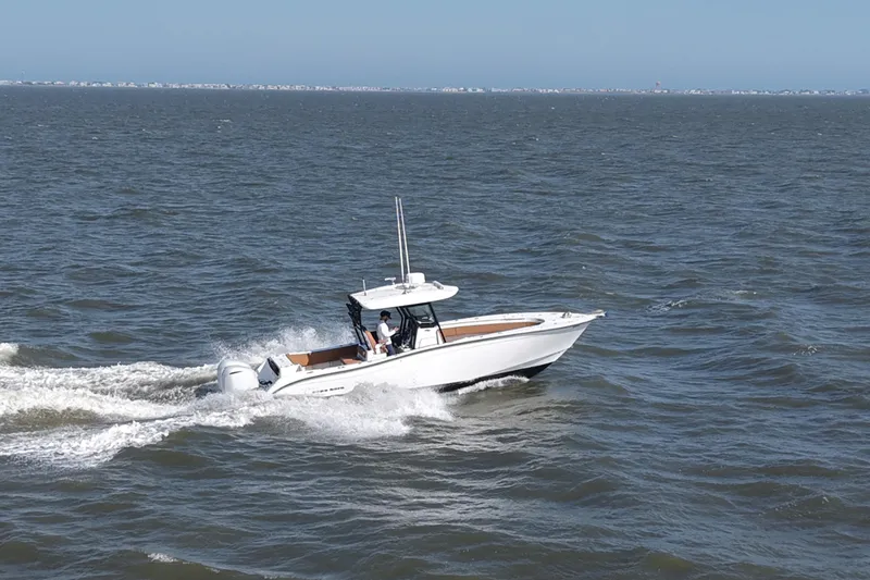 Slide: The Image of 2021 Cape Horn 32 T boat cruising on open water under clear skies. - 15