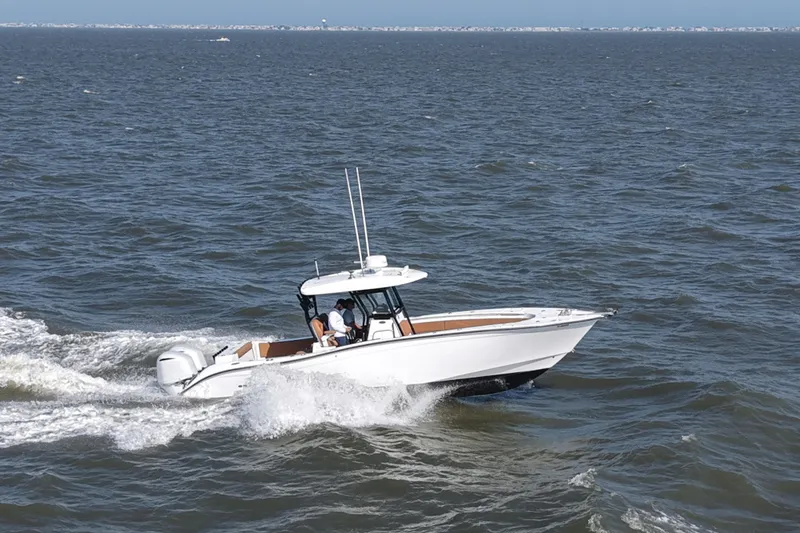 Slide: The Image of 2021 Cape Horn 32 T boat cruising on open water. - 16
