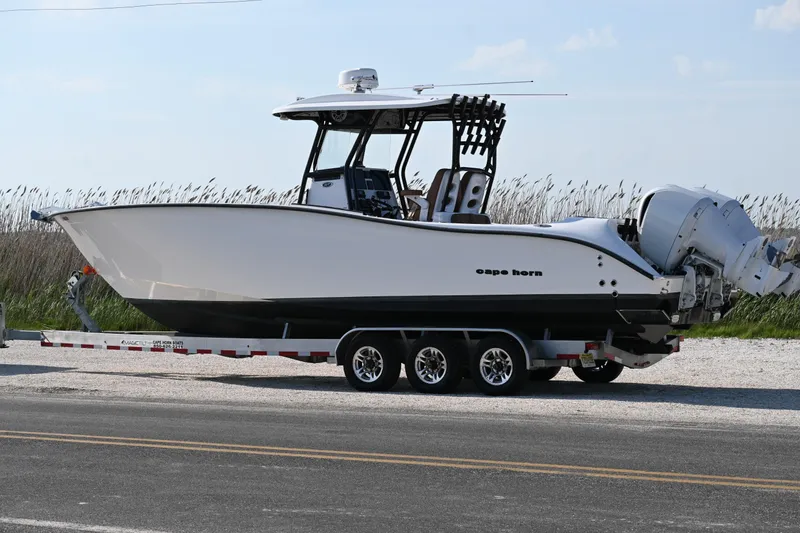 Slide: The Image of 2021 Cape Horn 32 T boat on trailer, side view, outdoors. - 2