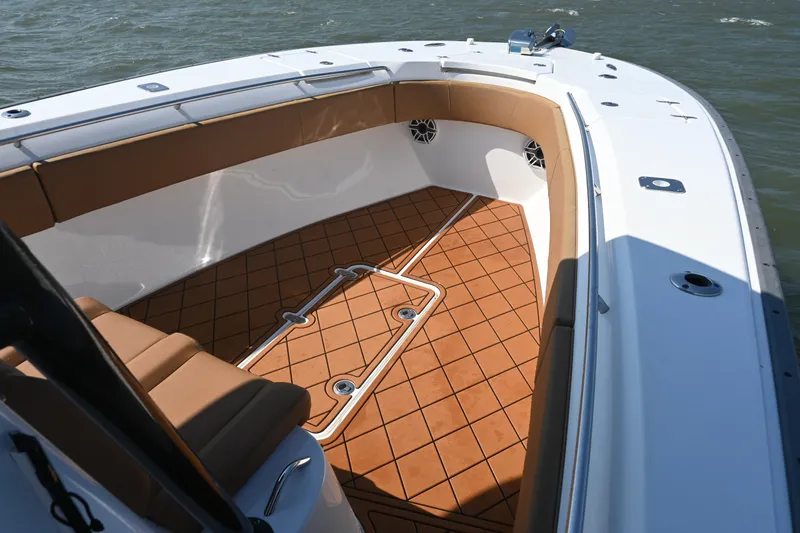 Slide: The Image of 2021 Cape Horn 32 T boat interior with tan seating and non-slip deck flooring. - 20