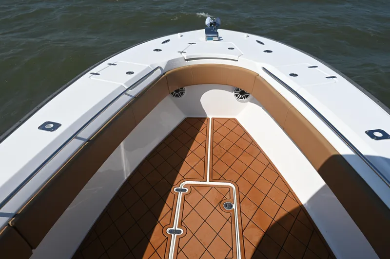 Slide: The Image of 2021 Cape Horn 32 T boat deck with tan seating and brown flooring. - 22