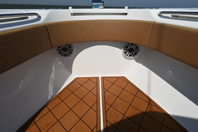 Slide: The Image of Interior of 2021 Cape Horn 32 T boat with cushioned seating and speakers. - 24