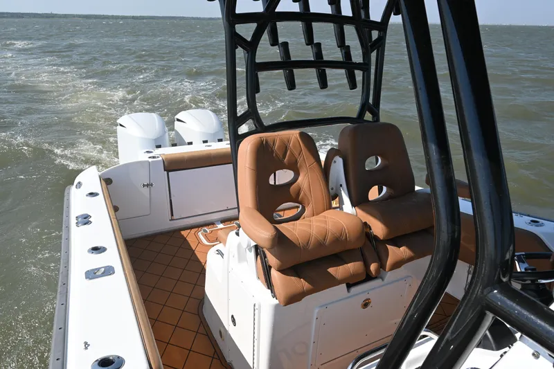 Slide: The Image of 2021 Cape Horn 32 T boat interior with dual seats and ocean view. - 27