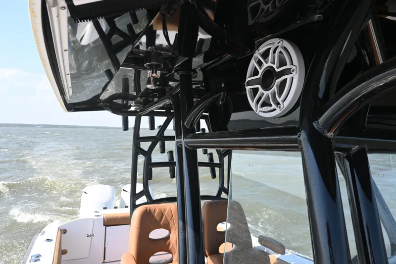 Slide: The Image of 2021 Cape Horn 32 T boat interior with speaker and seating, cruising on water. - 28