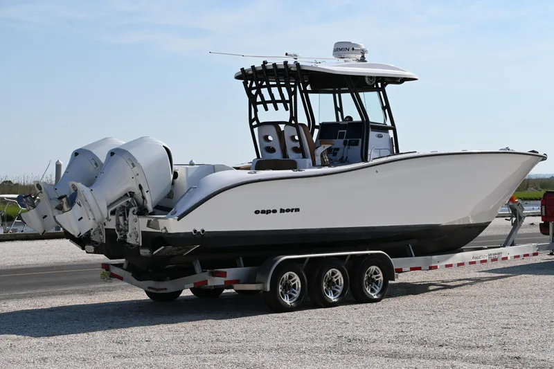 Slide: The Image of 2021 Cape Horn 32 T boat on trailer with dual engines, ready for transport. - 3