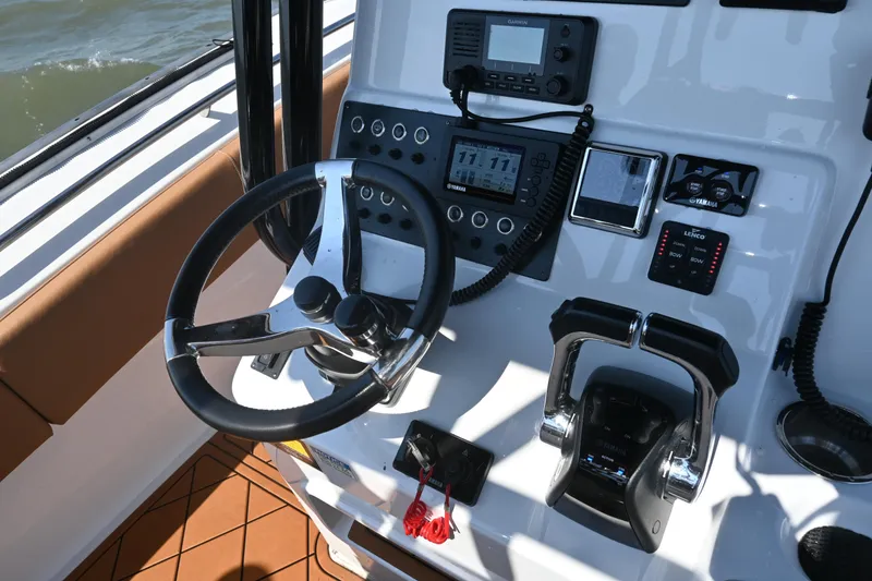 Slide: The Image of Steering console of 2021 Cape Horn 32 T boat with navigation controls and instruments. - 31