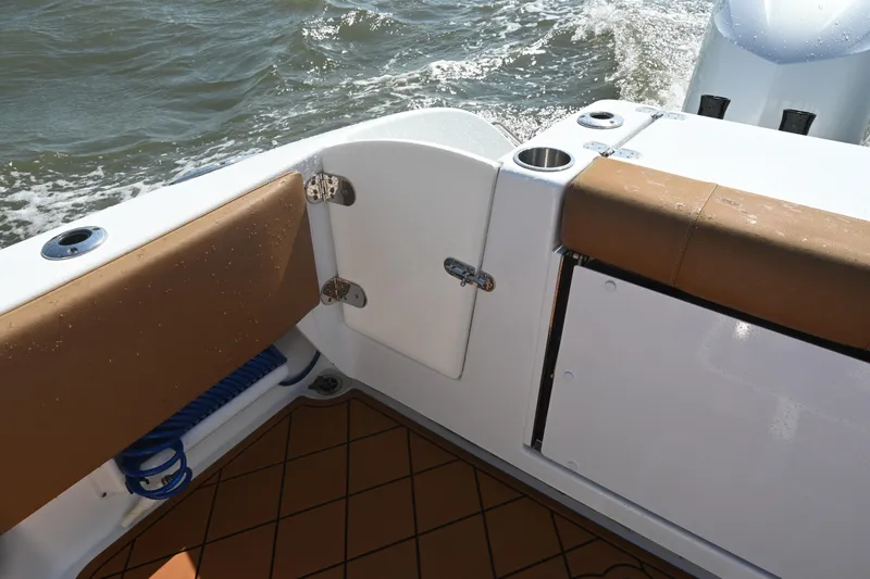 Slide: The Image of 2021 Cape Horn 32 T boat interior with cushioned seating and ocean view. - 37