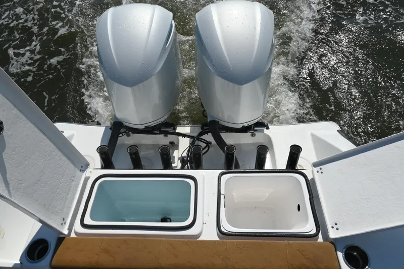 Slide: The Image of 2021 Cape Horn 32 T boat with dual engines and fishing rod holders. - 38