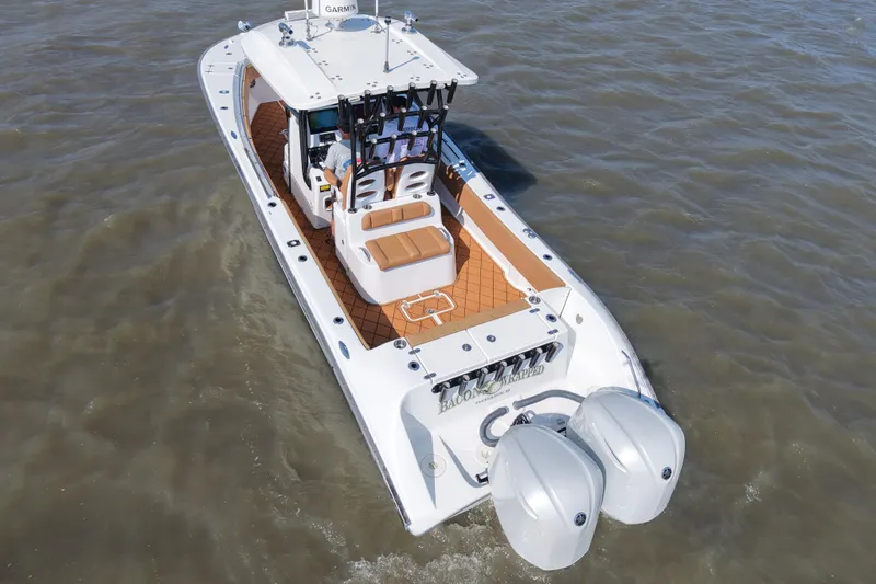 Slide: The Image of 2021 Cape Horn 32 T boat with dual engines cruising on water. - 8