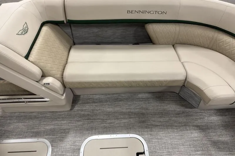 Slide: The Image of Luxurious seating on 2026 Bennington 24 M L-Bench pontoon boat, featuring elegant beige upholstery. - 16