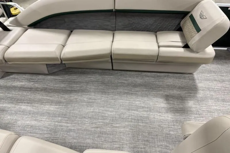 Slide: The Image of 2026 Bennington 24 M L-Bench boat interior with beige seating and modern design. - 18
