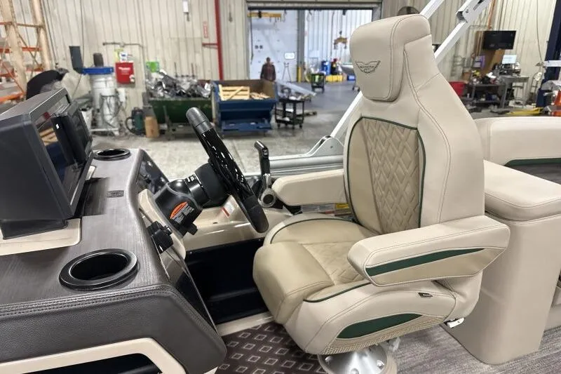 Slide: The Image of Luxurious interior of 2026 Bennington 24 M L-Bench boat with plush captain's chair. - 22