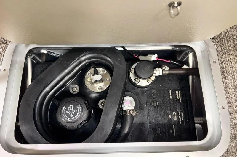 Slide: The Image of Fuel compartment of 2026 Bennington 24 M L-Bench boat, showing hoses and connections. - 26