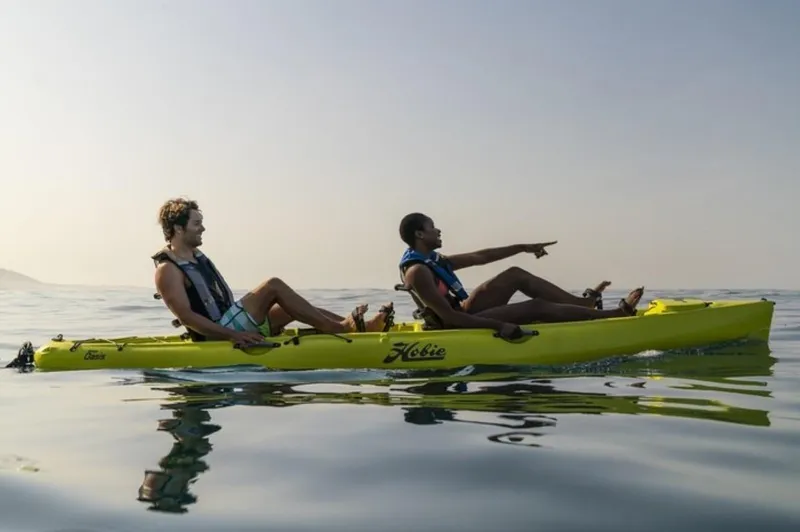 The Image of Two people kayaking on a 2022 Hobie Mirage Oasis in calm waters. - 0