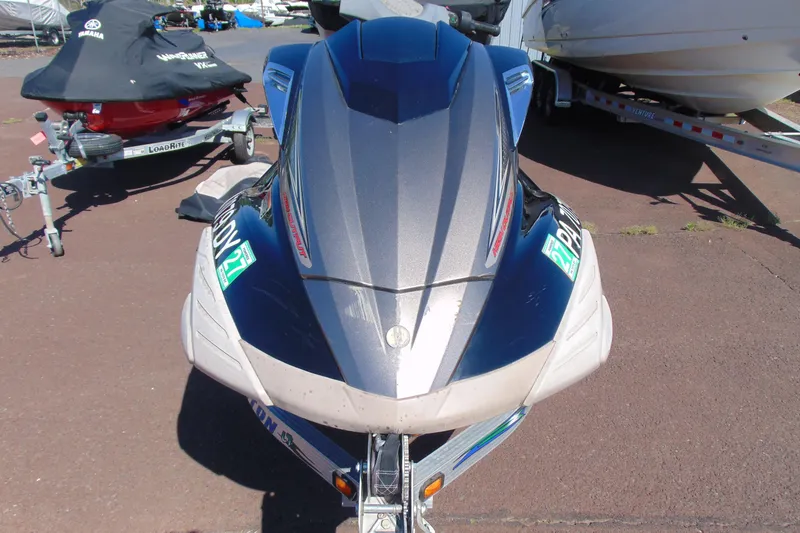 Slide: The Image of 2010 Yamaha WaveRunner FX HO jet ski on trailer, parked outdoors. - 2