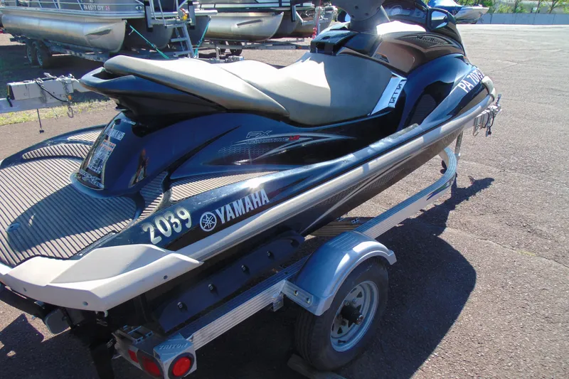 Slide: The Image of 2010 Yamaha WaveRunner FX HO on trailer, parked outdoors, showcasing sleek design and branding. - 6