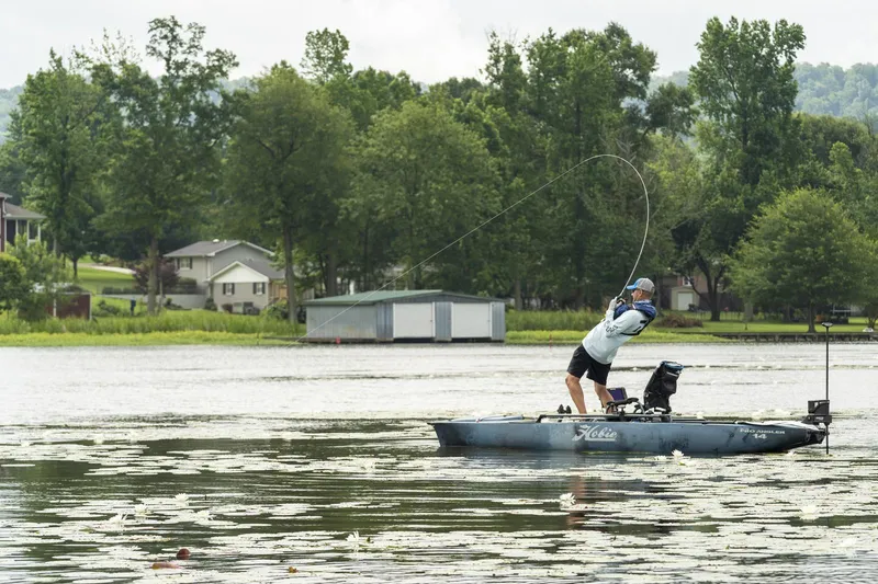 Slide: The Image of Angler fishing on a 2023 Hobie Mirage Pro Angler 14 with 360 Drive Technology. - 15