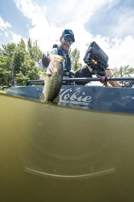 Slide: The Image of Angler on Hobie Mirage Pro Angler 14 kayak with 360 Drive Technology, holding a fish. - 3