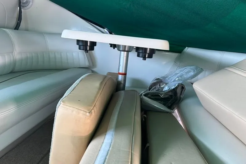 Slide: The Image of Interior of 2000 Cruisers Yachts 3575 Express with white seating and table. - 7