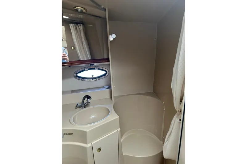 Slide: The Image of Bathroom interior of 2000 Cruisers Yachts 3575 Express with sink and shower. - 13