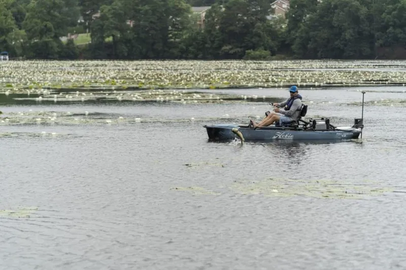 Slide: The Image of Man fishing on a 2023 Hobie Mirage Pro Angler 12 kayak with 360 Drive Technology. - 2