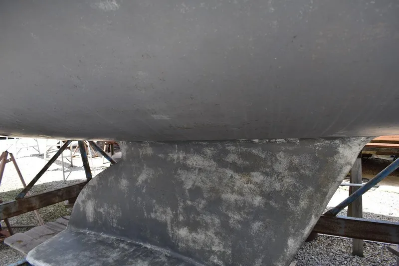 Slide: The Image of Close-up of a 2001 Catalina 310 sailboat keel on a stand. - 14