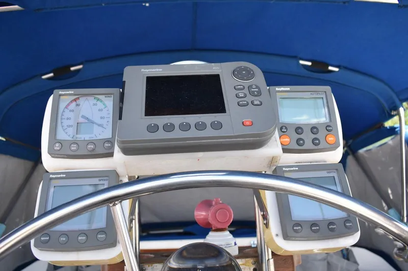 Slide: The Image of Cockpit of 2001 Catalina 310 sailboat with Raymarine navigation instruments. - 19