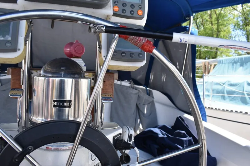 Slide: The Image of Steering wheel and navigation instruments on a 2001 Catalina 310 sailboat. - 20