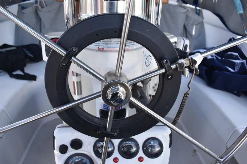 Slide: The Image of Steering wheel and controls of a 2001 Catalina 310 sailboat cockpit. - 21
