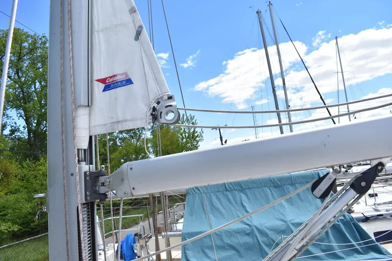 Slide: The Image of Sailboat mast and boom of a 2001 Catalina 310 with clear blue sky background. - 24