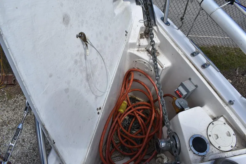 Slide: The Image of Anchor locker of a 2001 Catalina 310 sailboat with chain and cables. - 30