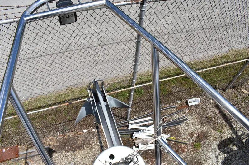 Slide: The Image of Stainless steel bow pulpit of a 2001 Catalina 310 sailboat, with anchor and chain. - 33