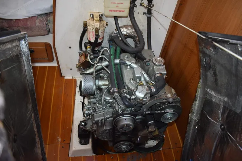 Slide: The Image of Engine compartment of a 2001 Catalina 310 sailboat, showcasing detailed mechanical components. - 67