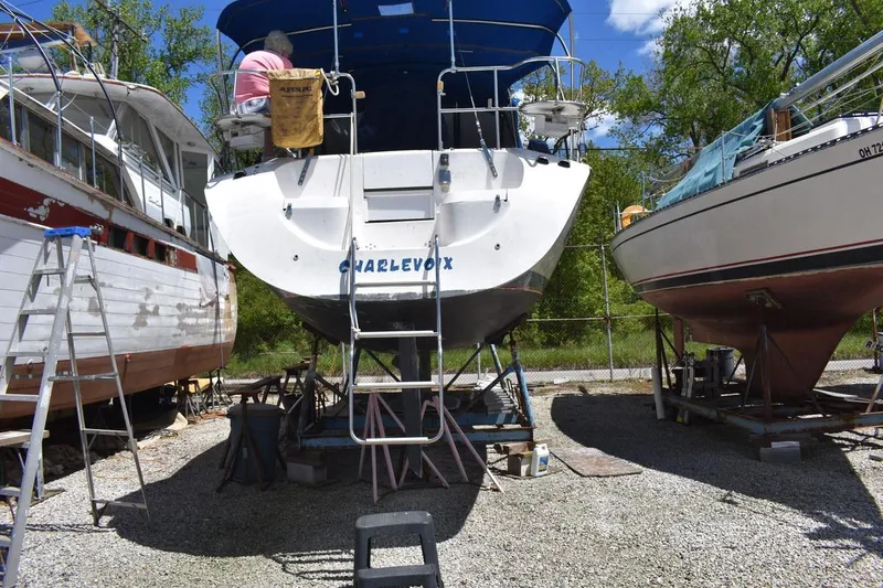 Slide: The Image of Catalina 310 sailboat from 2001 in a boatyard, undergoing maintenance. - 8